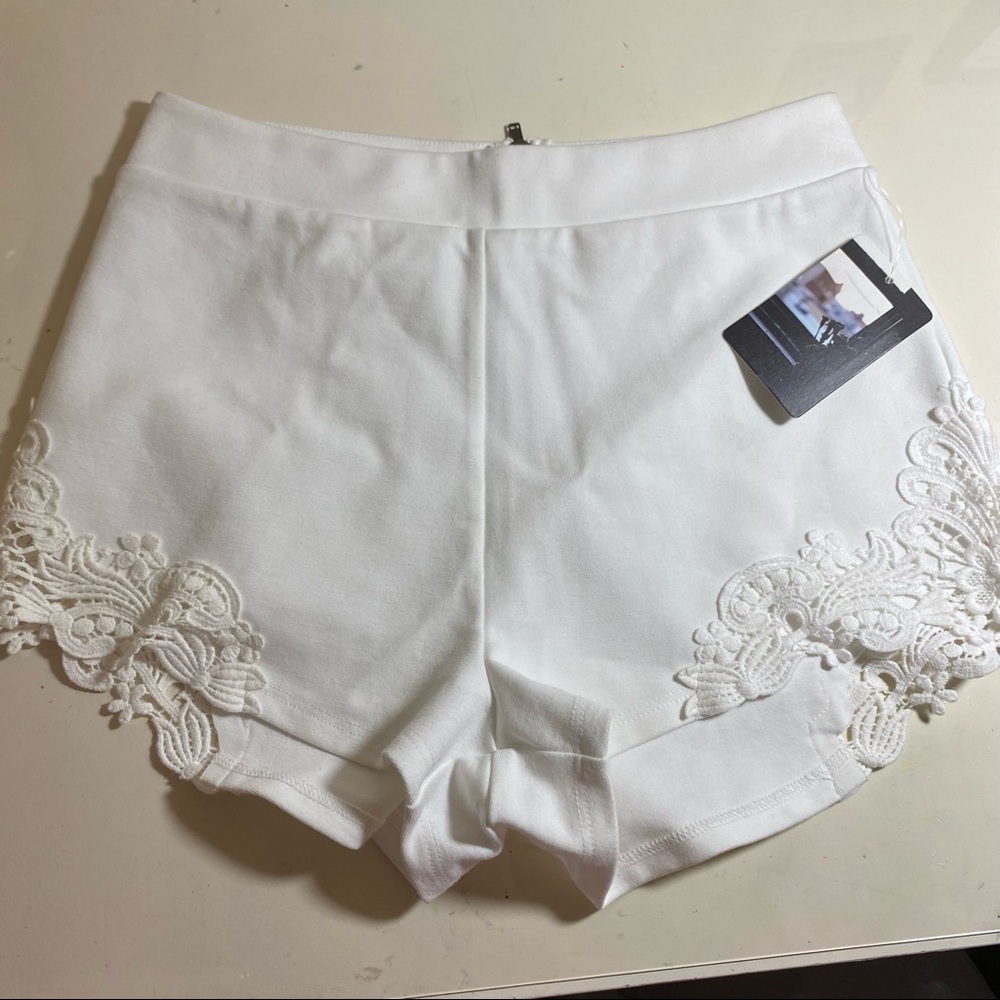 Beautiful feminine shorts with appliqué lace inset on sides. Perfect for summer!